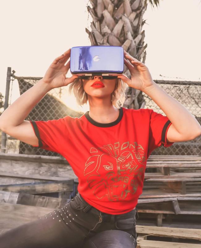 Virtual Reality in Marketing Women Wearing VR Headset ON Wood - Virtual Reality in Marketing