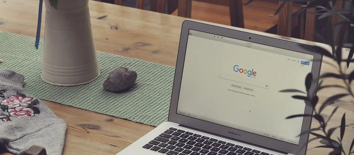 Laptop on Table showing Google
